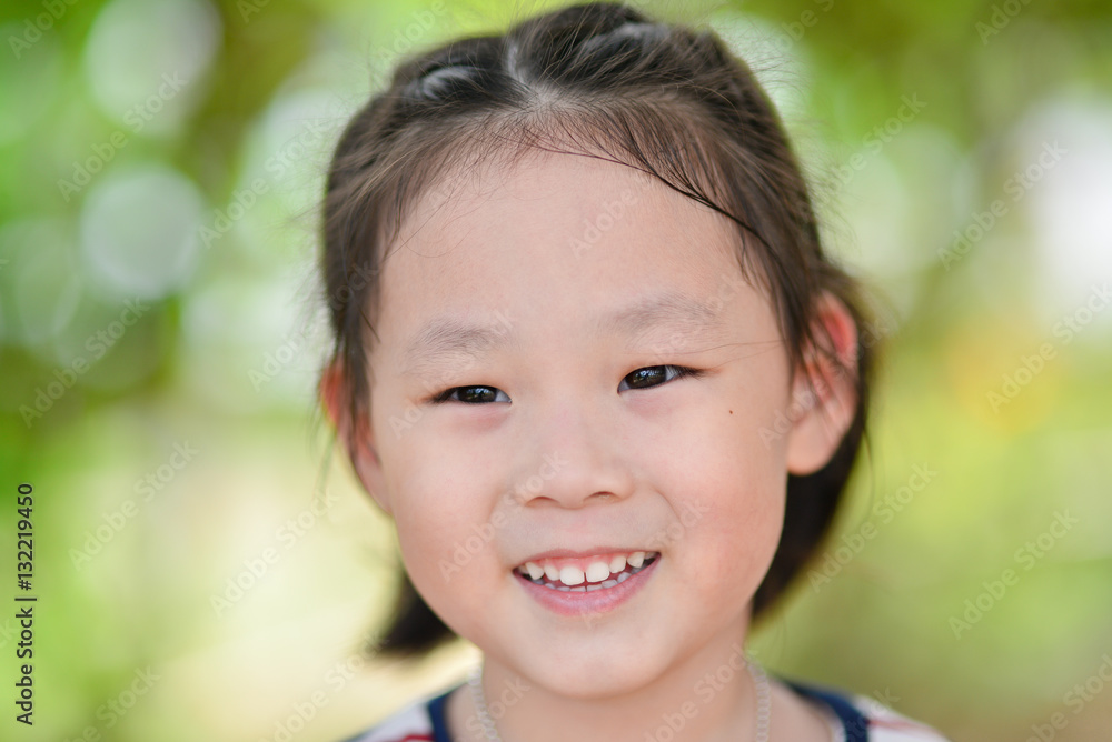 Closeup smiling little girl, Outdoor potrait Closeup smiling little girl, Outdoor potrait