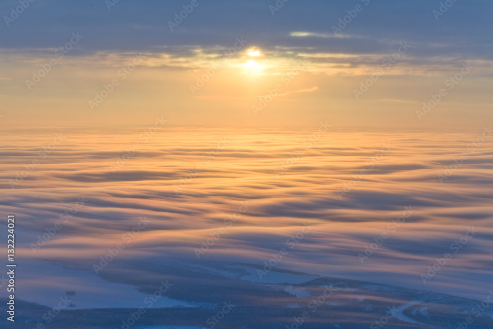 Beautiful sunset over clouds, top view