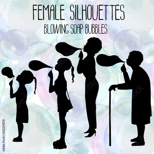 Female silhouettes blowing soap bubbles