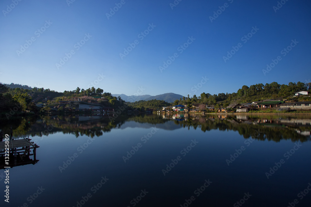 Beautiful scene of houses view with reflections. Village in Thai