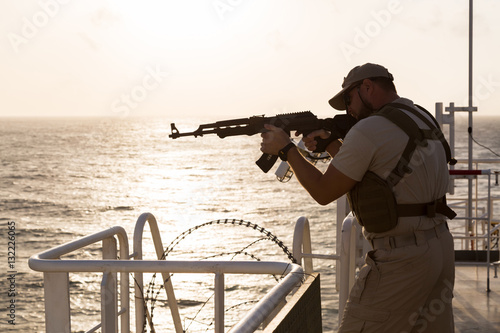 Guard on board sea going vessel in aden gulf photo