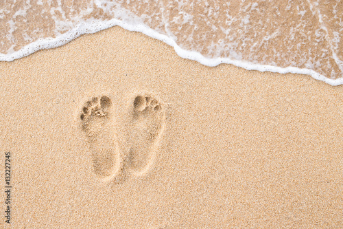Footprint on beach in sand background