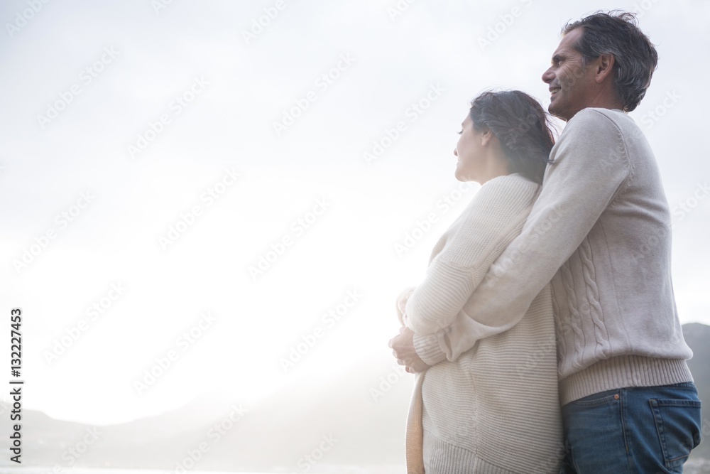 Romantic couple embracing each other on beach Romantic couple embracing each other on beach