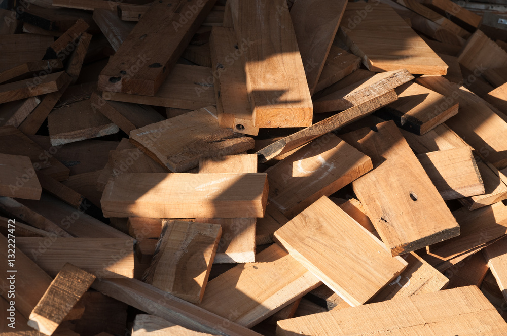 Pile of wood logs for build Furniture production,sew natural wood scraps, ready to recycle and reuse process in improved waste management under efficient sustainable approach to save environment Pile of wood logs for build Furniture production,sew natural wood scraps, ready to recycle and reuse process in improved waste management under efficient sustainable approach to save environment