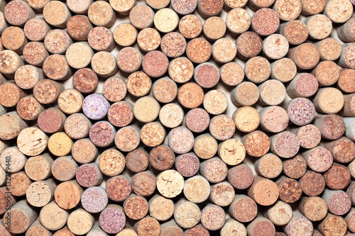 Wall of many different wine corks. Closeup of wine corks. Wine corks with traces of wine and corkscrew.