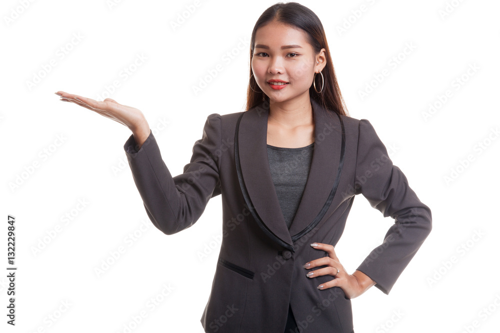 Young Asian business woman present with her hand. Young Asian business woman present with her hand.