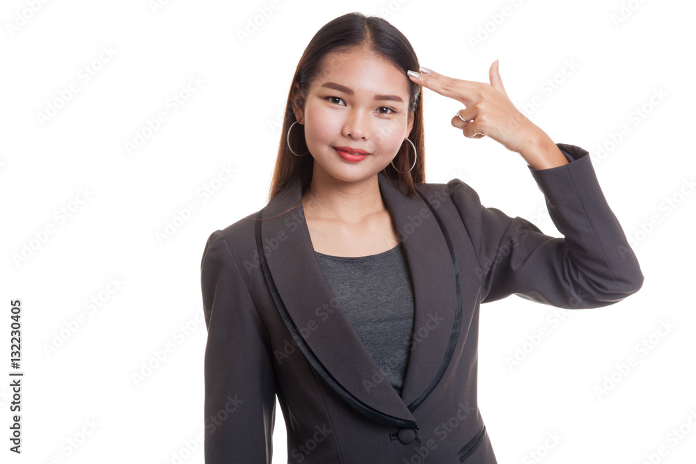 Beautiful young Asian woman holding fingers in gun gesture. Beautiful young Asian woman holding fingers in gun gesture.