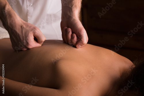 Male hands doing back massage