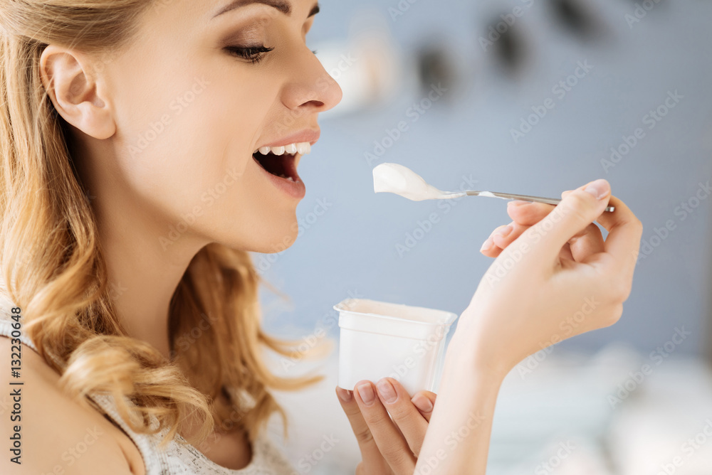 Portrait of pregnant woman eating yoghurt Portrait of pregnant woman eating yoghurt