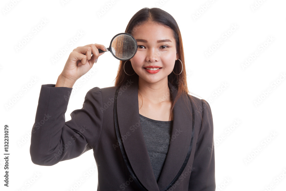 Young Asian business woman with a magnifying glass. Young Asian business woman with a magnifying glass.