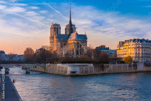 Picturesque cityscape of Cathedral of Notre Dame de Paris at sunset, France