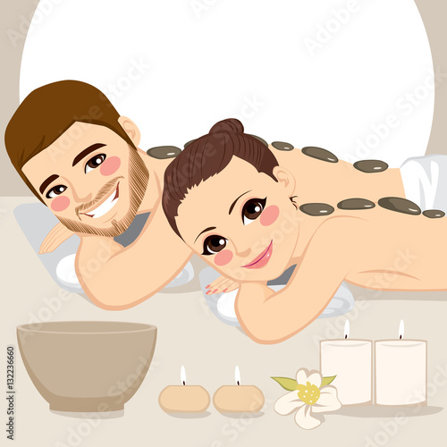 Attractive young couple on a spa enjoying hot stone massage treatment