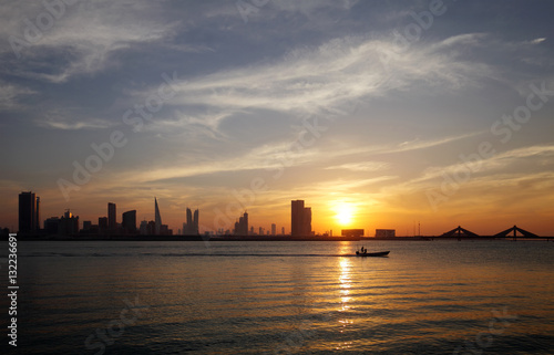 Bahrain skyline and a fishing boat