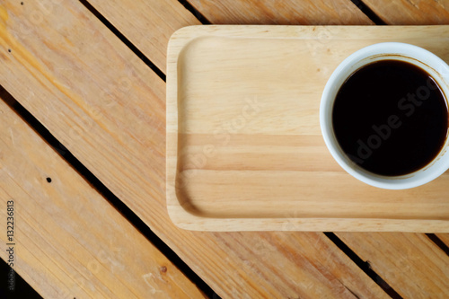 flat-Lay view of hot black coffee on rough table and have some space for write wording 
