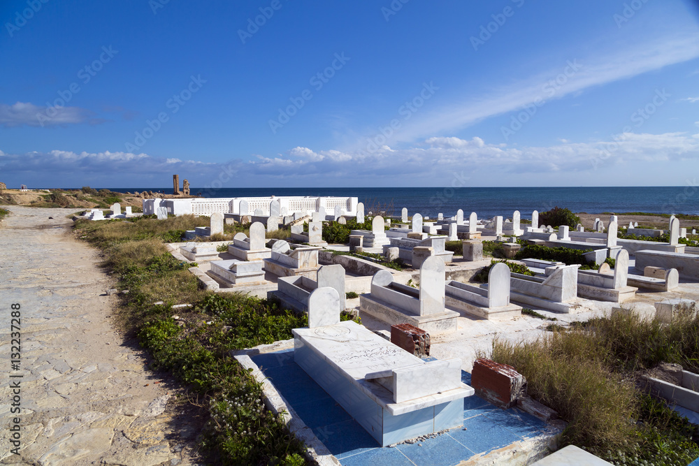 Obraz premium View from the coastal town of Mahdia in Mahdia Governorate of Tunisia, eastern Mediterranean coast with ruins of Fatimid Caliphate and graveyard.