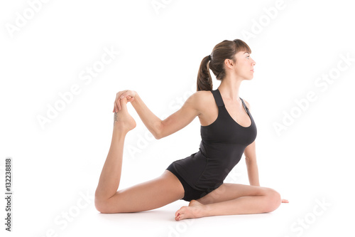 Elegant beautiful woman practicing yoga on isolated white background.