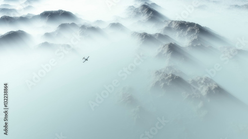 Aerial of single engine airplane over mountain range in thick la