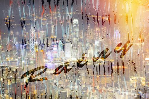 Rainy season with cityscape background  the inscription on the glass.