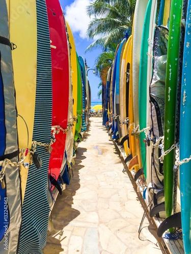 surfboards stored on the beach in hawaii