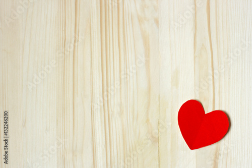 Heart on wooden surface.