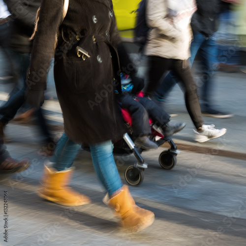 people on a shopping street in motion blur