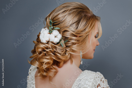 Wedding hairstyle close-up detail with cotton winter flower