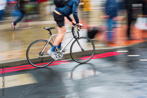 bicycle rider on a wet street