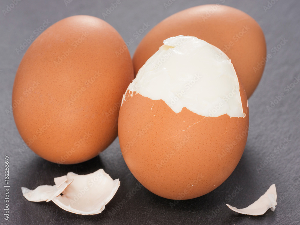 three boiled eggs on slate background three boiled eggs on slate background