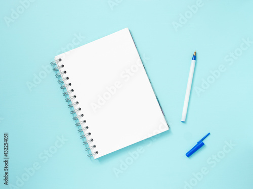blank note paper on blue background