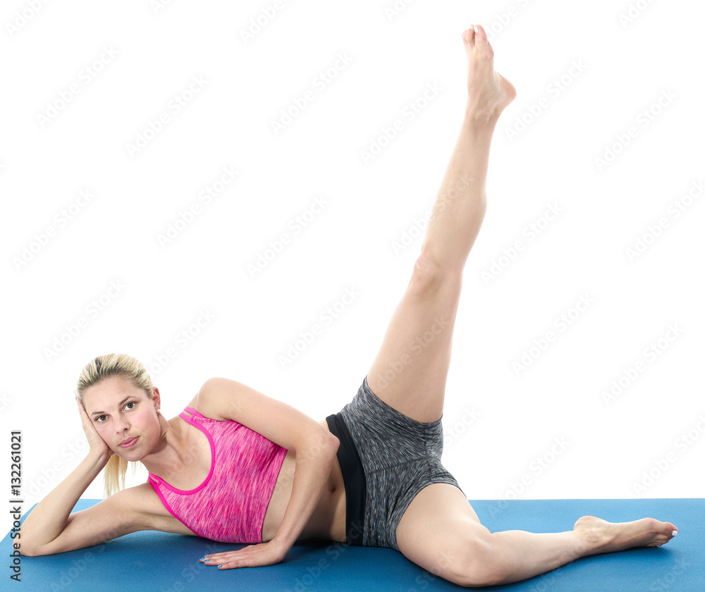 Woman making pilates mat exercises