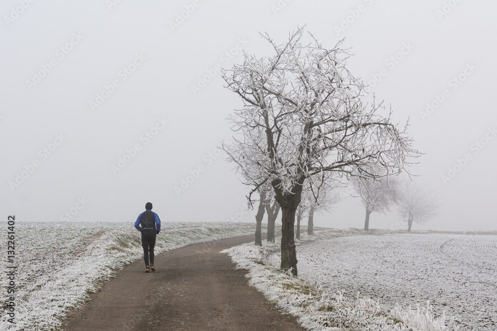 jogging in winter during fog