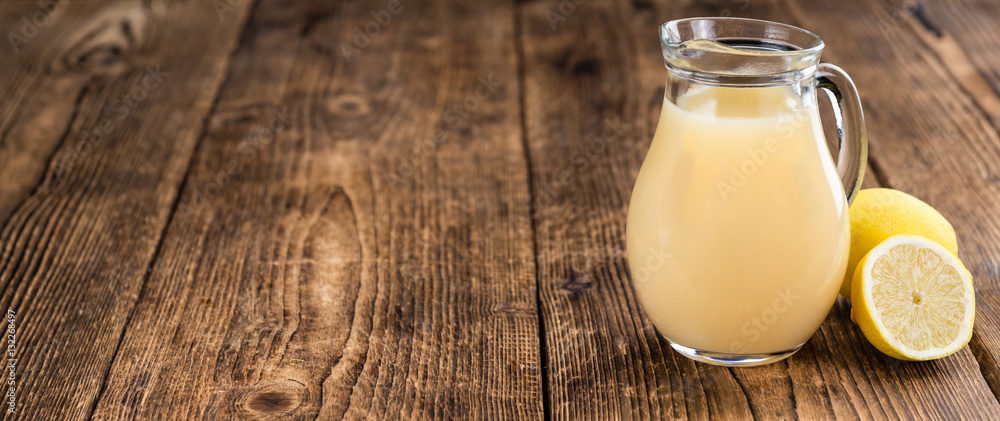 Wooden table with Lemon Juice (selective focus) Wooden table with Lemon Juice (selective focus)