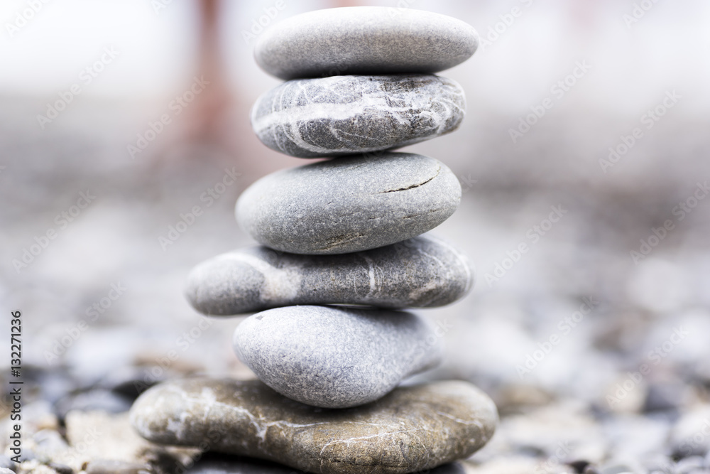 concept of harmony and balance with rocks on the beach. in the background a beach concept of harmony and balance with rocks on the beach. in the background a beach