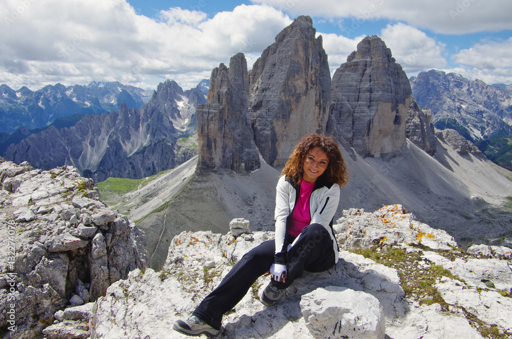 Young attractive female hiker in front of Tre Cime di Lavaredo