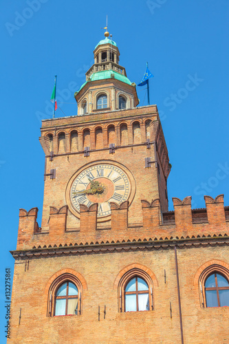clock tower of Palazzo d'Accursio or Comunale overlooking Piazza Maggiore, today the seat of the municipality of Bologna in Italy.