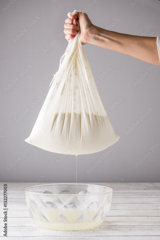 Greek Yogurt being strained Greek Yogurt being strained