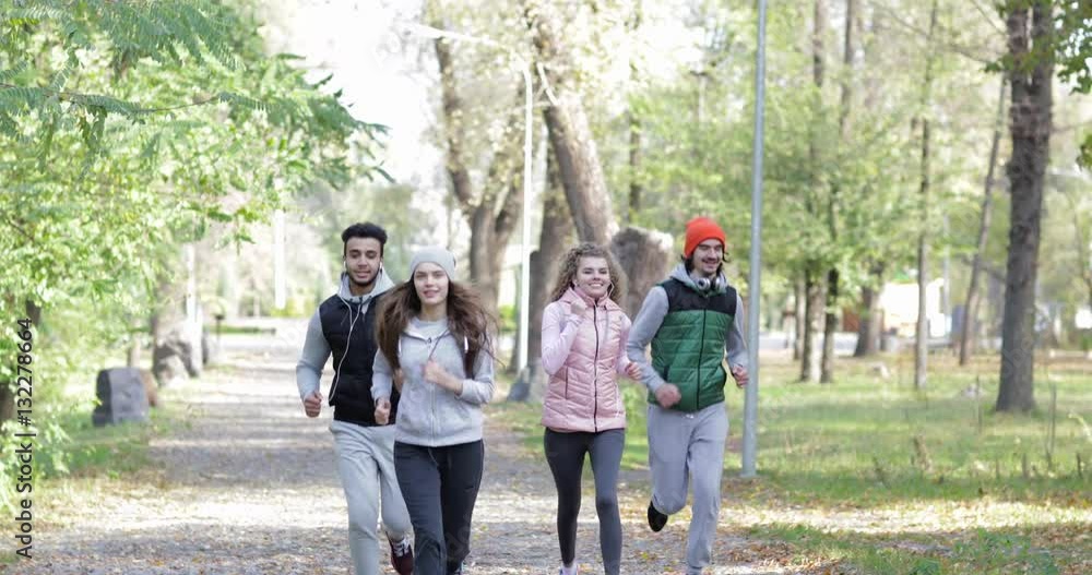 People Group Run Park Young Active Fitness Runner Exercising Outdoor Sport Man And Woman Jogging Morning Autumn Forest Slow Motion 60 Fps People Group Run Park Young Active Fitness Runner Exercising Outdoor Sport Man And Woman Jogging Morning Autumn Forest Slow Motion 60 Fps