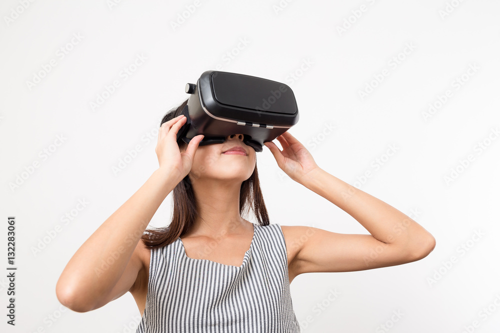 Woman looking though the VR device Woman looking though the VR device
