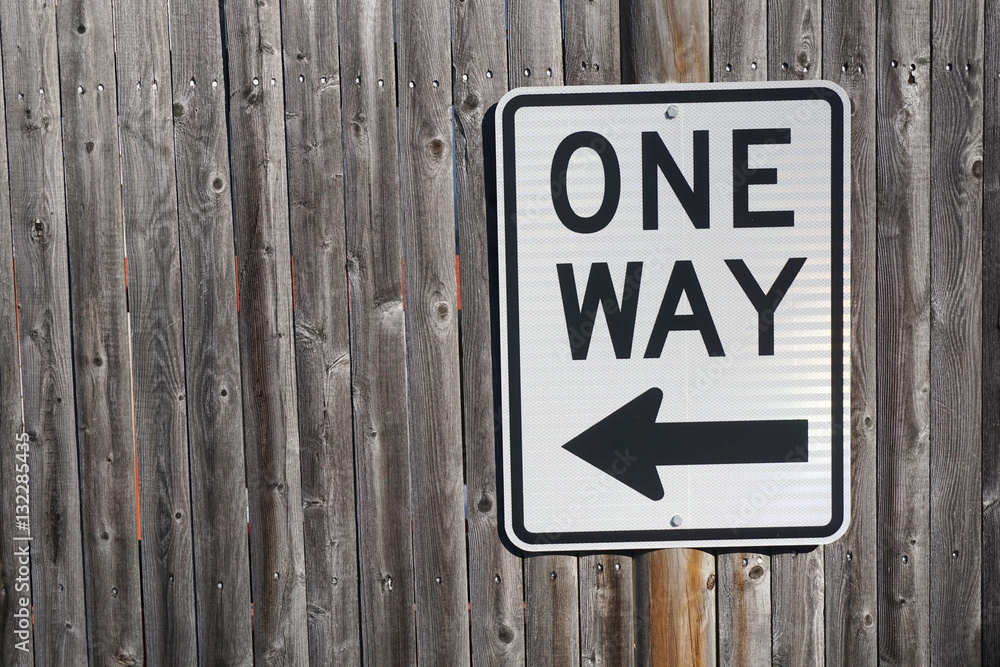 one way sign on wood wall background one way sign on wood wall background