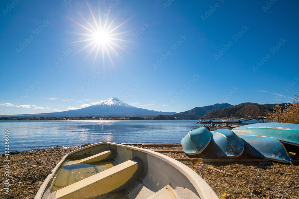 Sun star effect shot with Mountain Fuji and boats