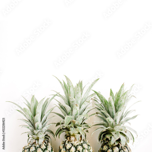 Three pineapples. Flat lay, top view