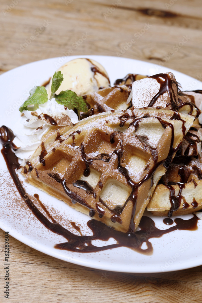 Close up of vanilla ice cream with waffle on wood table backgrou Close up of vanilla ice cream with waffle on wood table backgrou