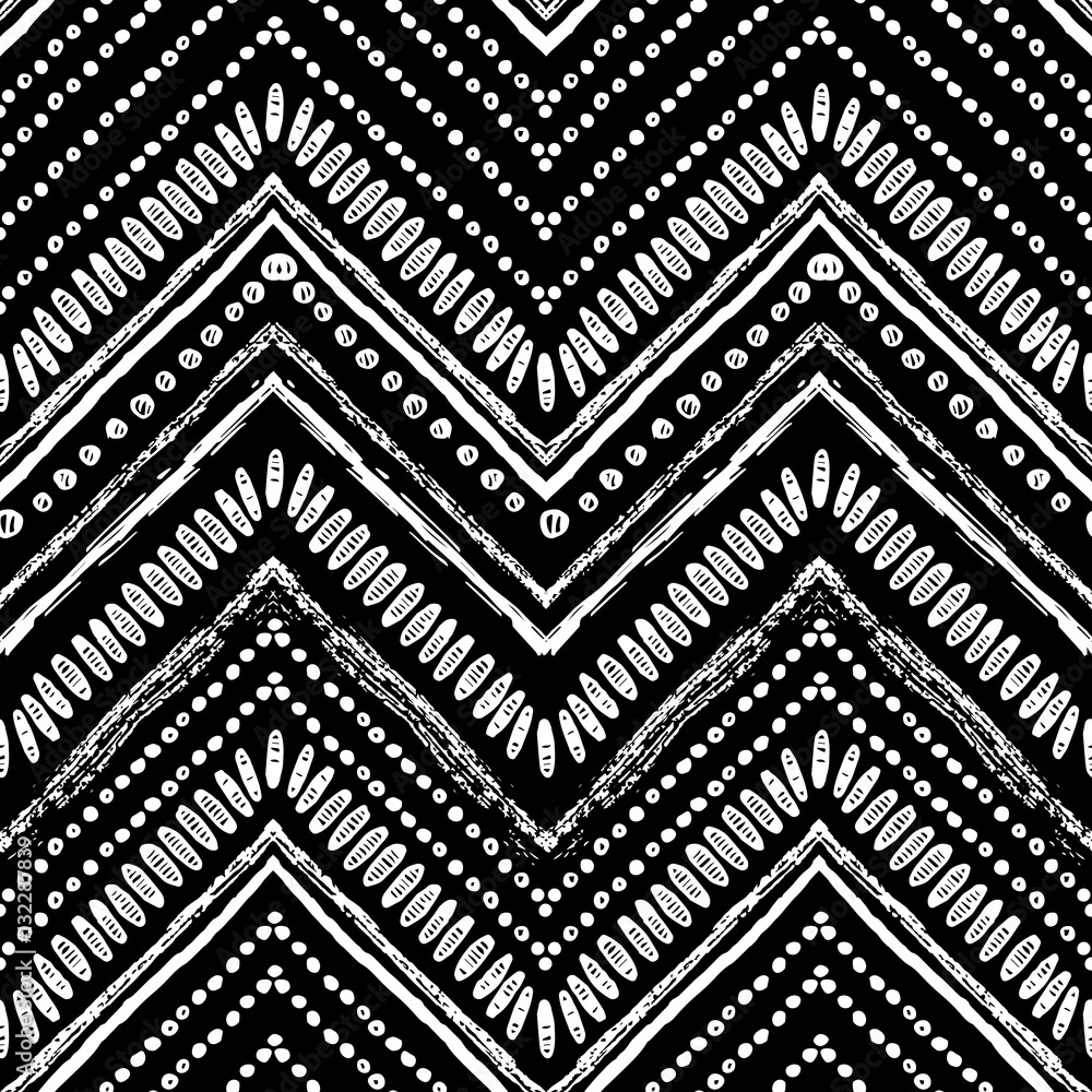 Obraz premium Hand drawn Zigzag and stripe pattern. Vector illustration for tribal design. Black and white colors. Ethnic theme