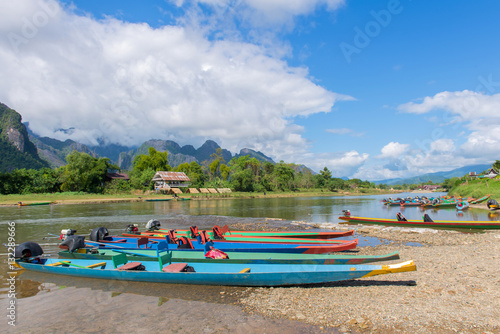 Fototapeta Naklejka Na Ścianę i Meble -  long tail boats on Song river, Vang Vieng, Laos