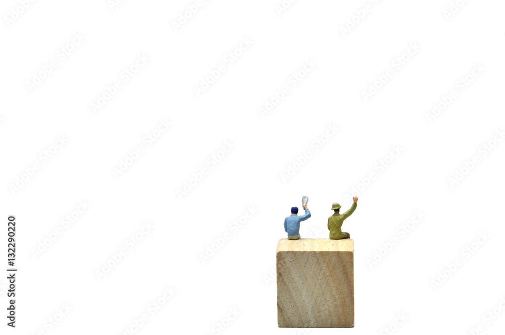 Selective focus, 2 men say hello action on wooden cube, business Selective focus, 2 men say hello action on wooden cube, business