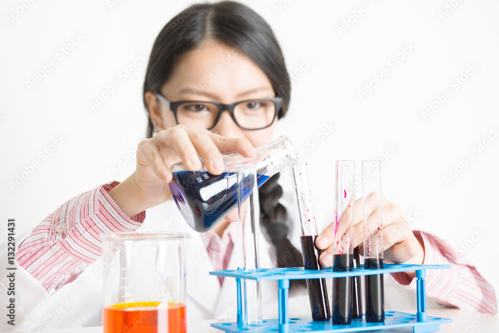 Young Asian female scientist doing experiment in lab Young Asian female scientist doing experiment in lab