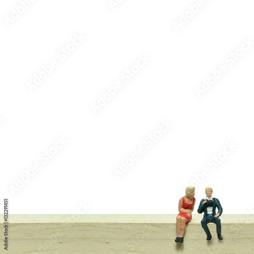 Selective focus, miniature people sitting on wooden block, busin