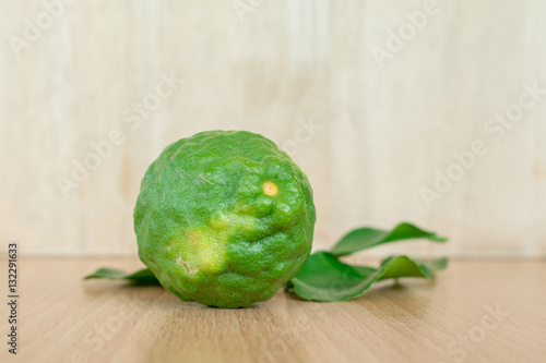 Close up bergamot fruit on wooden background, (Kaffir lime)