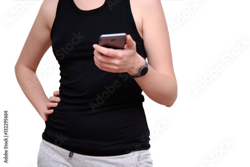 The girl watches the activity at a training by means of the application and fitness tracker.