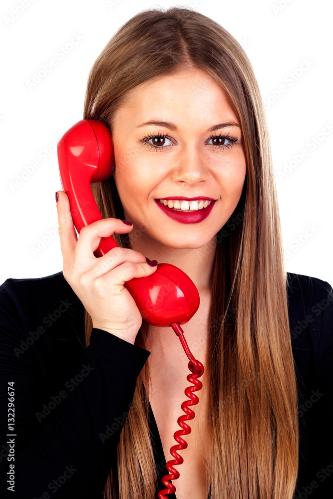 Stylish woman with a red phone StockFoto Adobe Stock
